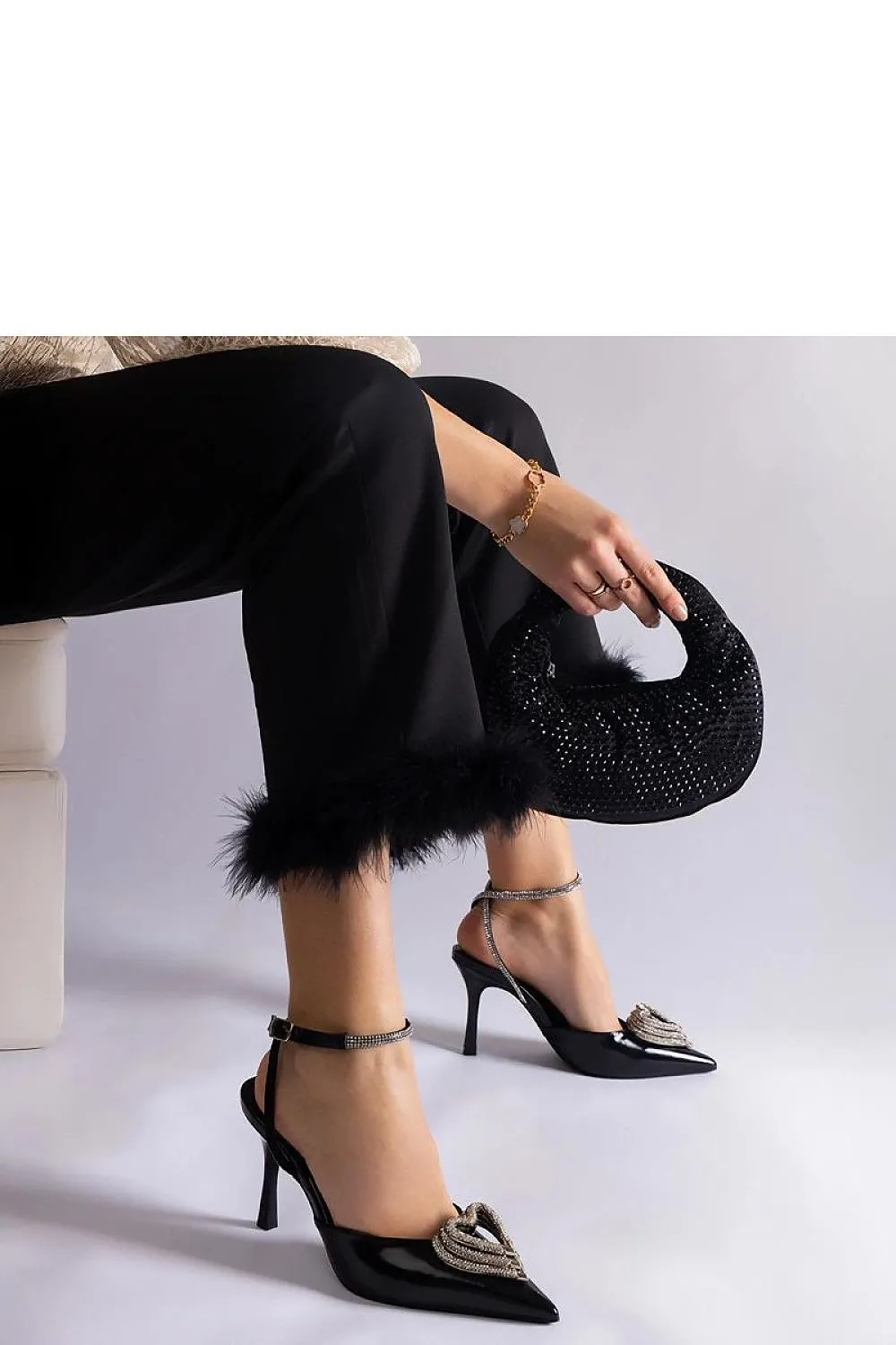 Black high heels with an open heel
